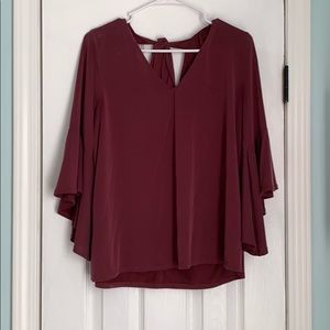 Bell sleeve maroon colored top